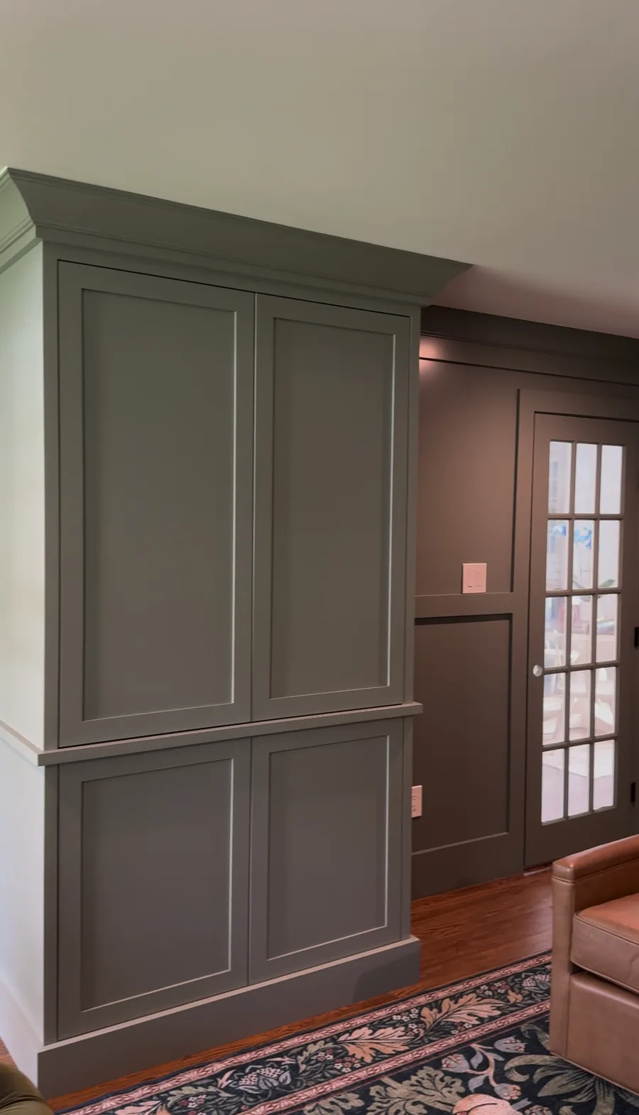 Custom painted entertainment cabinet with crown moulding, Newtown Square family room